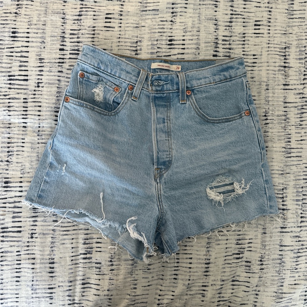 Levi’s Distressed Light Blue Denim Shorts